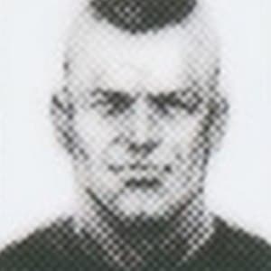 Portrait of a Mother Base recruit with very short gray hair