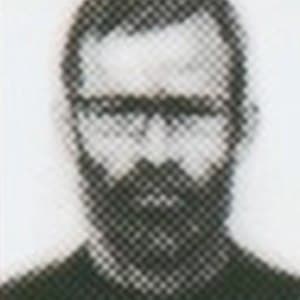 Portrait of a Mother Base recruit with a full beard and glasses
