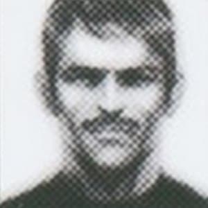 Portrait of a Mother Base recruit with a mustache and tousled hair